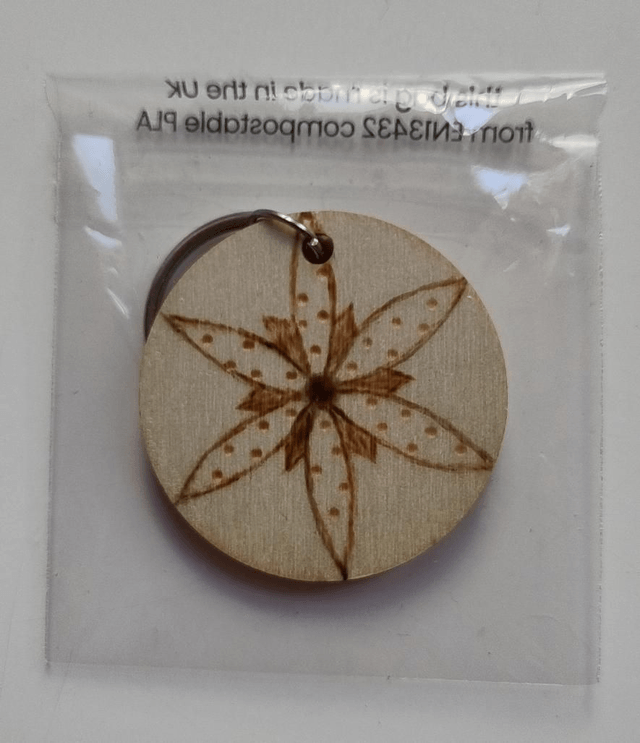 Keyring with flower and spiral designs