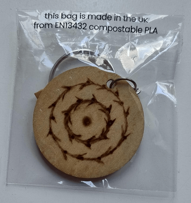 Keyring with flower and spiral designs